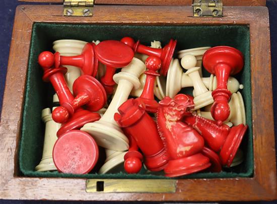 A small Staunton type ivory chess set, in mahogany box, kings 2.5in., missing one red pawn and the red king